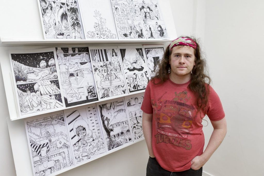 Sunderland University Illustration and Design student David Byrne with some of the work he left on the Metro Picture: DAVID WOOD