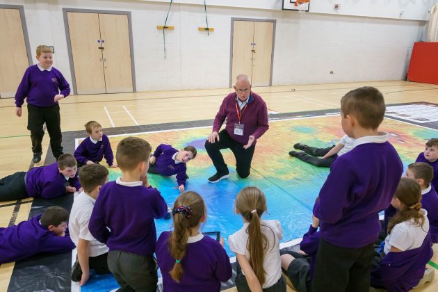 Aldrin Family Foundation Chief Innovation Officer Jim Christensen with Academy 360 Year 5 pupils