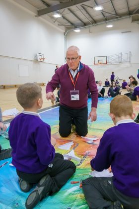 Aldrin Family Foundation Chief Innovation Officer Jim Christensen with Academy 360 Year 5 pupils